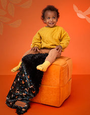 Narnia KoochicooTM baby blanket is the stunning new addition to the KoochicooTM blanket range. Featuring a truly sumptuous woodland print in soft beiges, & autumn hues, on the softest velour fabric, whilst the front side has elegant pompom detailing and beautiful fur.