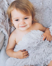 Gorgeous fluffy Whisper Grey KoochicooTM baby blanket is the perfect baby blanket for all occasions, out and about, snuggled up in doors, christenings and baby shower gift idea, it really is the perfect fluffy baby blanket.